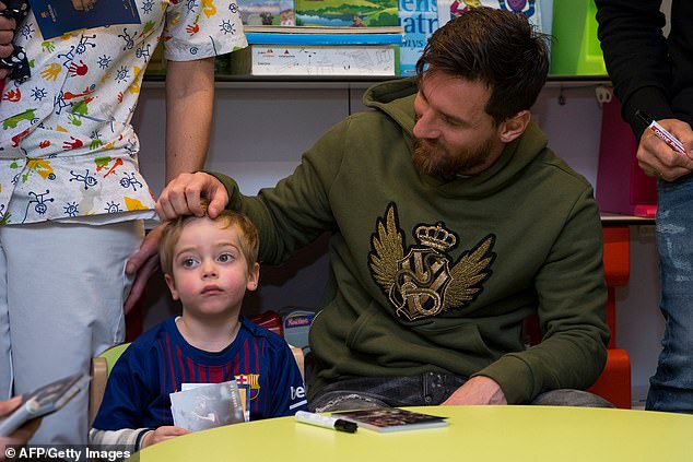 Club icon Messi, 31, ruffled the hair of a child who was wearing a replica Barcelona shirt
