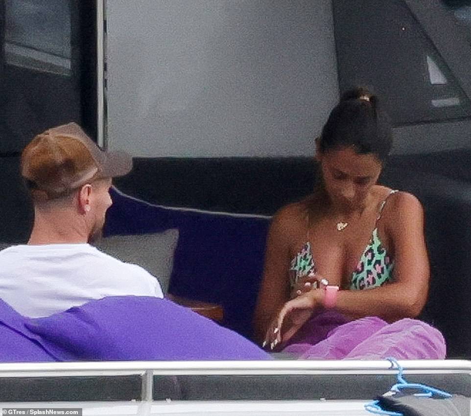 Chilling: The pair looked in good spirits as they relaxed on the yacht in Ibiza on Tuesday