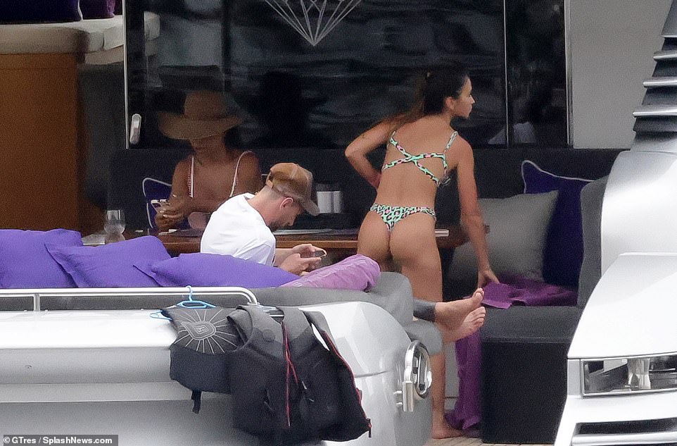 Racy: The brunette beauty also had her pert posterior on display in the green bikini