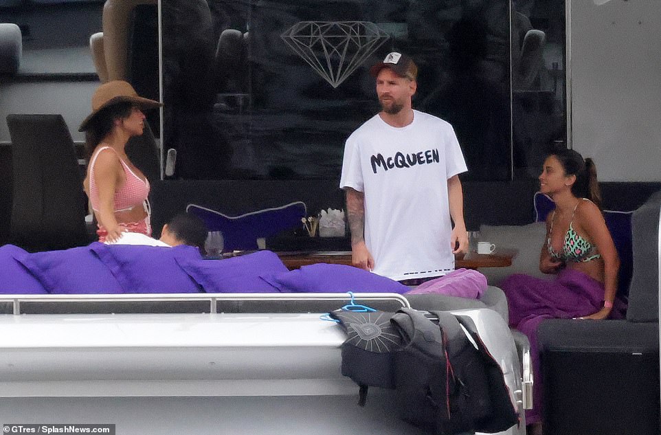 Catching up: The two couples chatted while on board as they holidayed together in Ibiza