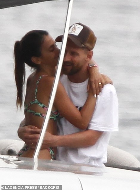 Smitten: They cuddled up while their friends snapped photos of the pair