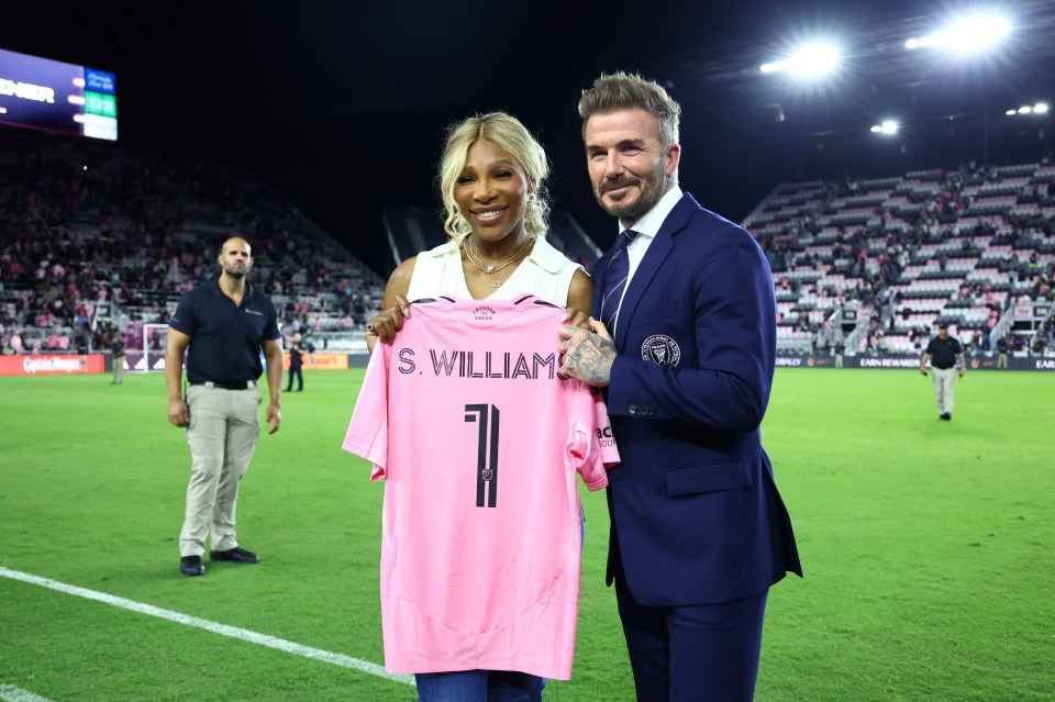 Serena Williams and David Beckham at a soccer game, holding an Inter Miami CF jersey.