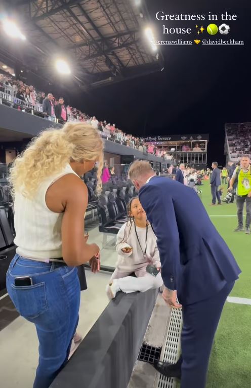 Serena Williams, David Beckham, and Olympia Williams at a soccer game.